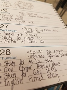 A student shows her agenda for the week