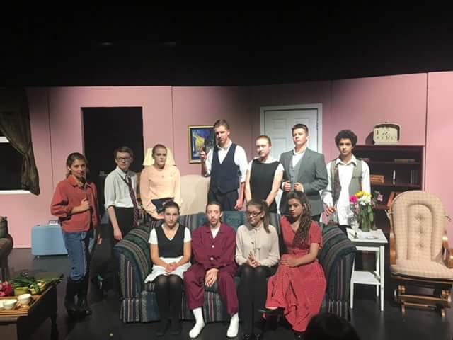 Cast Photo of And Then There Were None Front Row: Naomi Horner, Riley Berger, Graycen Bozard, Kelsey PrattSecond Row: Chaney Partrich, Drew Caldwell, Madeline Byrnside, Bryce Myers, Eleanor Lawton, Kolby Taylor, Nathan Delman