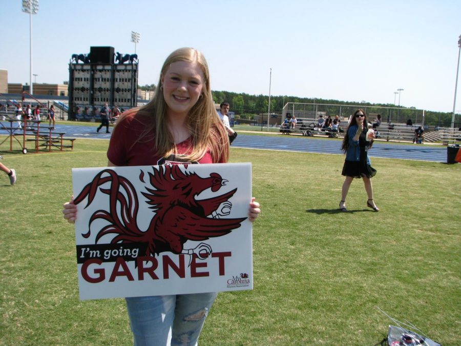 Carolann Derrick poses with her Carolina sign.