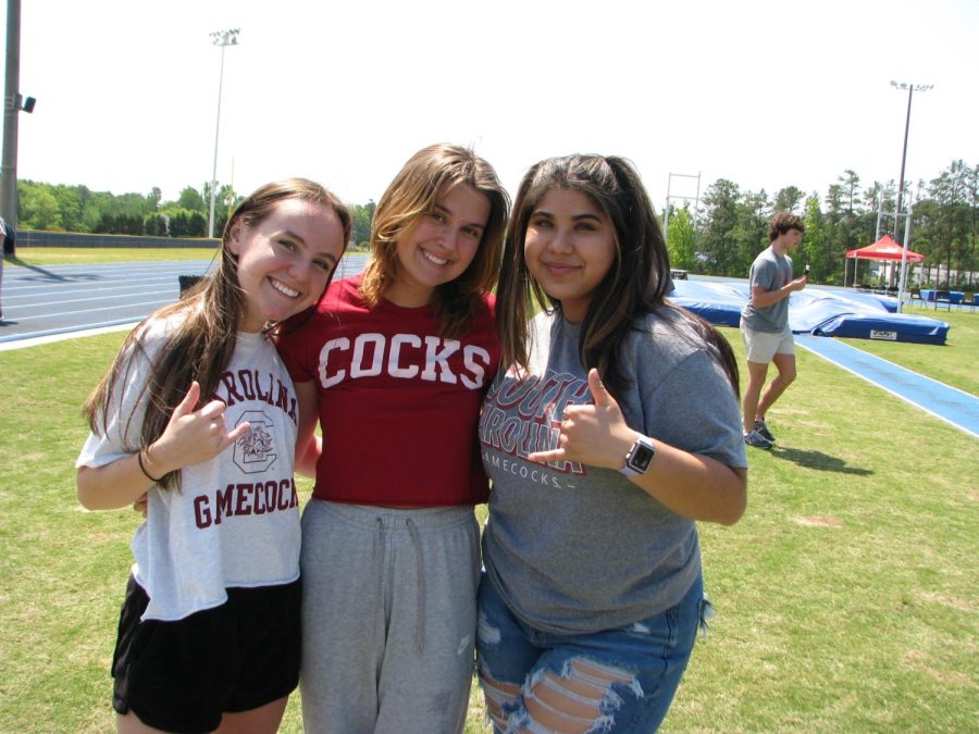 Emma Storey, Jordan Hayes, Bri Garcia wore their college shirts for Decision Day
