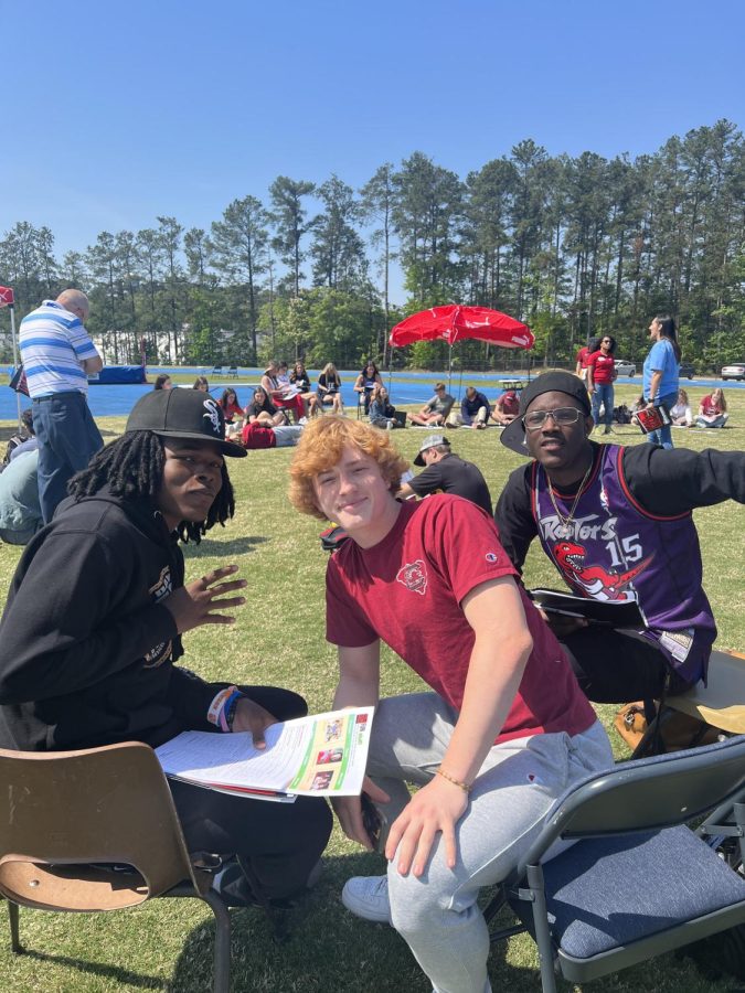 Seniors Justin Powe, Christian Bollman, Kenneth Parker at the Mad Money Day.