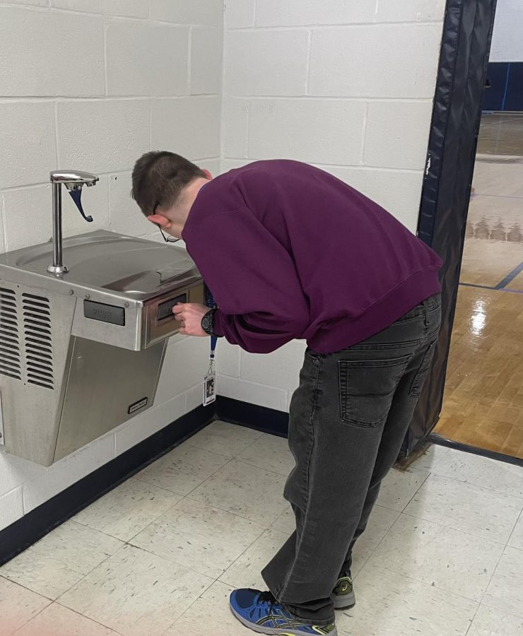 Jake Schaefer  Drinks from the water fountain in the small gym