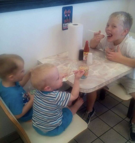 Senior Max Lambert shares a photo of he and his younger brothers eating at the Chapin Zestos