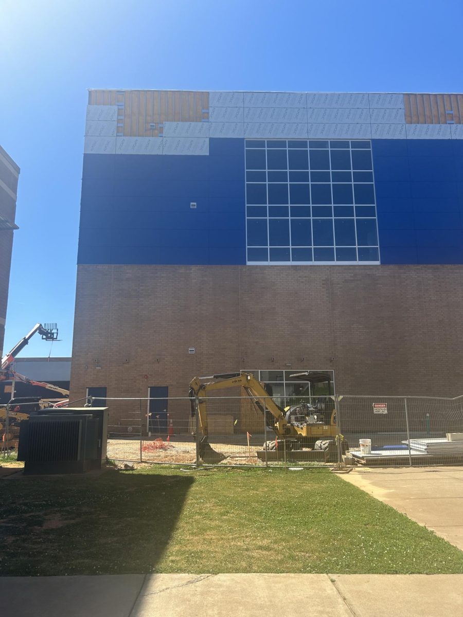 Construction continues with the addition of glass at the rear of the press box, brick siding and blue paneling. May 2024