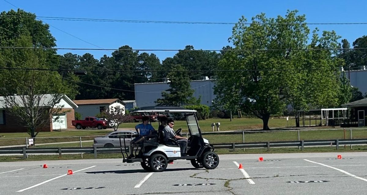 Students Driving the cart during Prom Promise