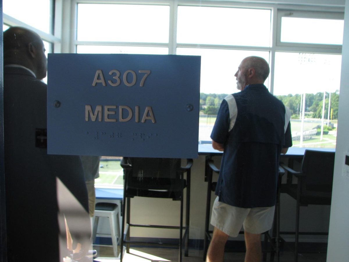  Chapin Principal Ed Davis and Head Football Coach Ryan Cole stand in one of the media rooms in the press box.