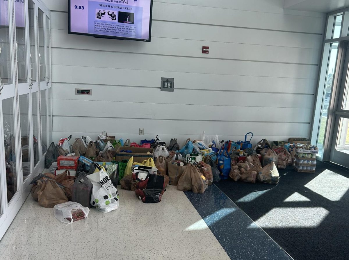 Donated items are lined up in the main lobby of the school.