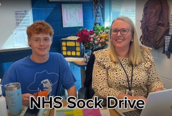 Will Robinson talks with Dr. Taylor about the NHS Sock Drive